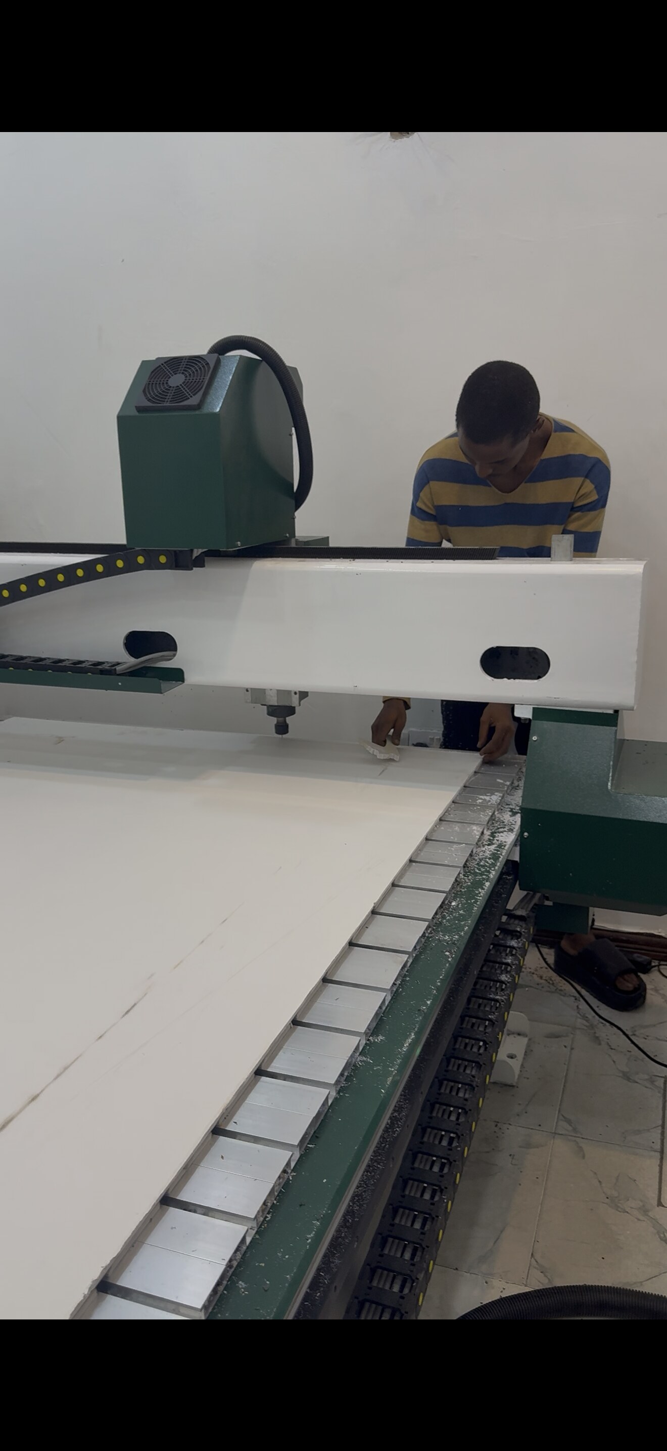 Brandspot technician operating the CNC cutting machine